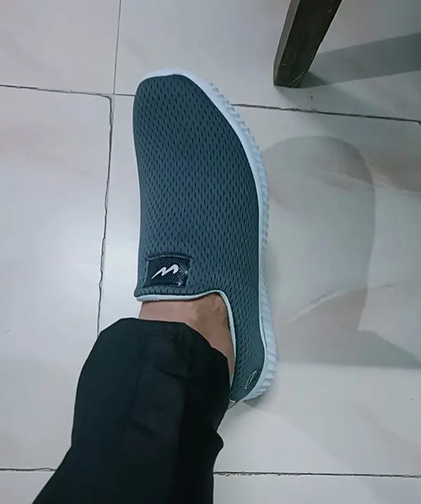 A-man-showing-slip-on-shoe