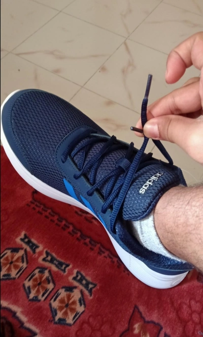 A-men-teaching-how-to-fasten-shoe-lace