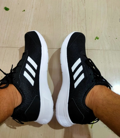 A-man-wore-adidas-black-Colour-running-shoes