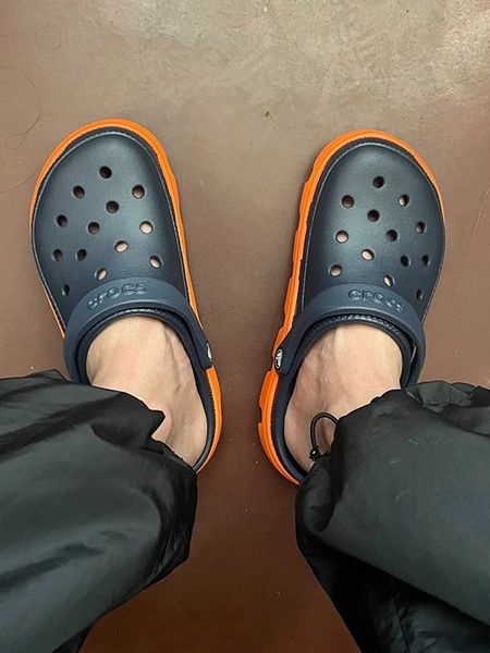 A-Man-wearing-Classic-Black-orange-crocs