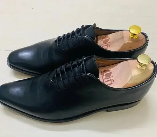 Wooden-Shoe-Tree-Inserted-Inside-Black-Formal-Shoes